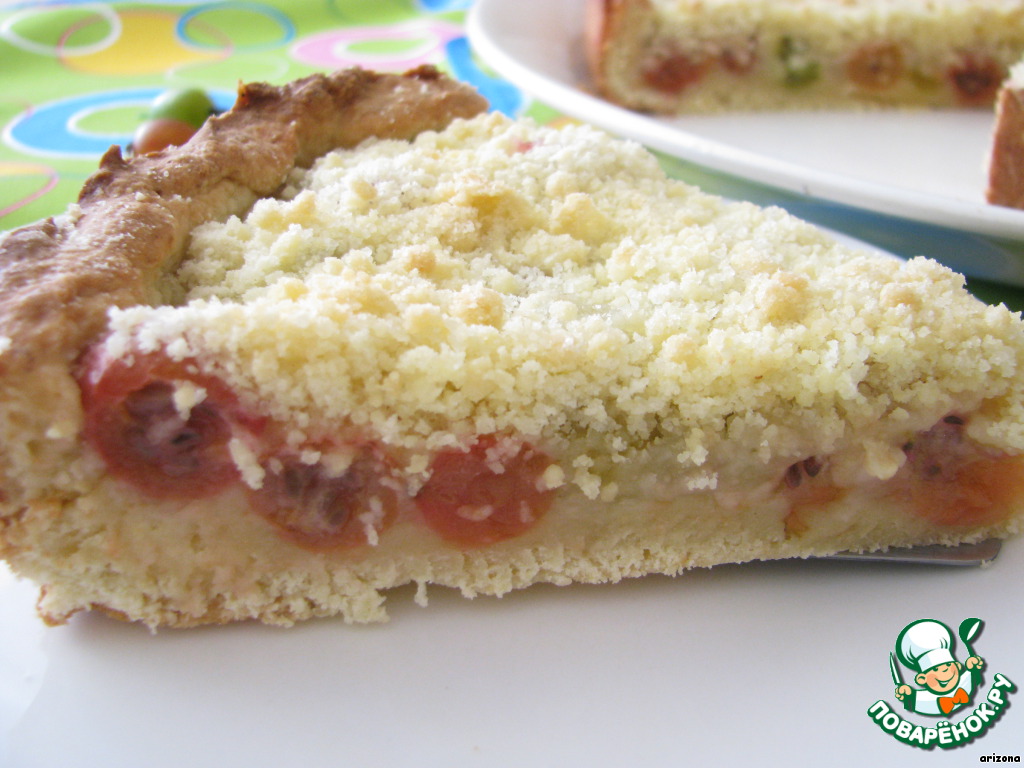 Open pie made of yeast dough with gooseberries