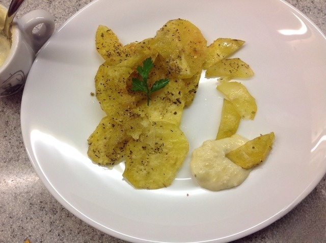 Potato chips with cheese sauce