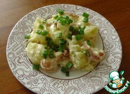 Warm potato salad with cheese sauce