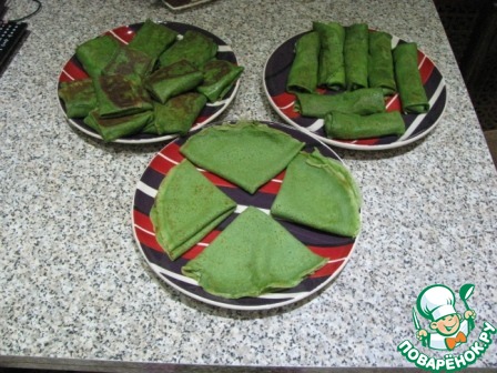 Green pancakes with cheese and garlic