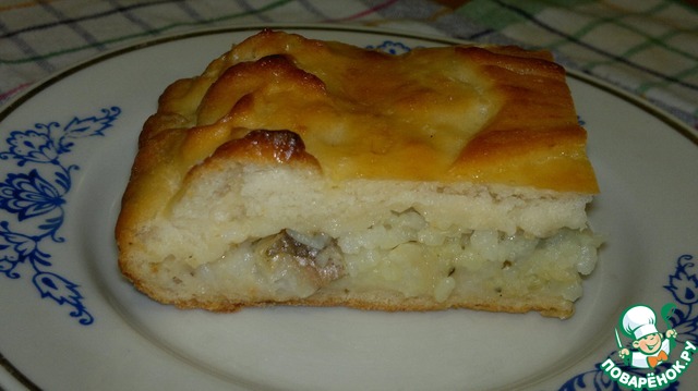 Pie from potato dough with rice and fish