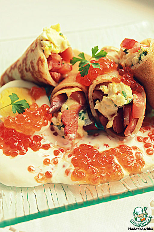 Soft cheese with smoked salmon in pancakes