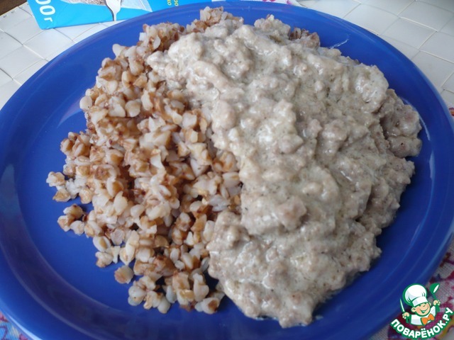 The meat in milk sauce with buckwheat