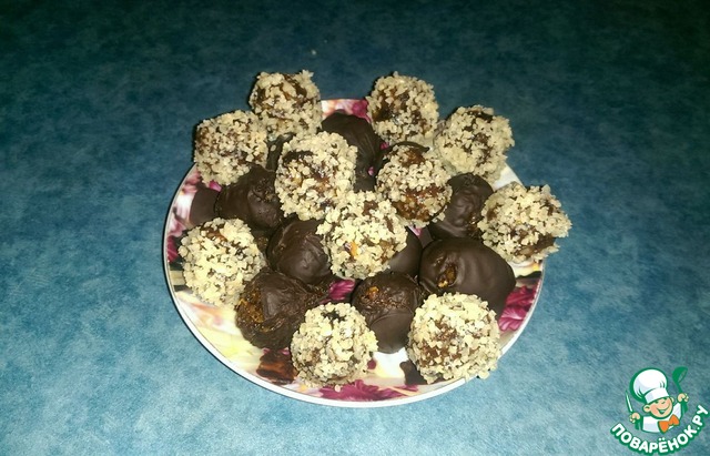 Candy made from dried fruits and nuts in chocolate