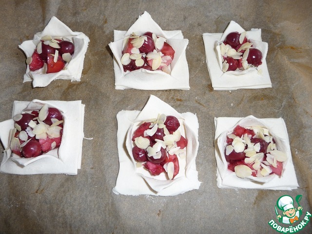 Tarts of flaky pastry with cherries