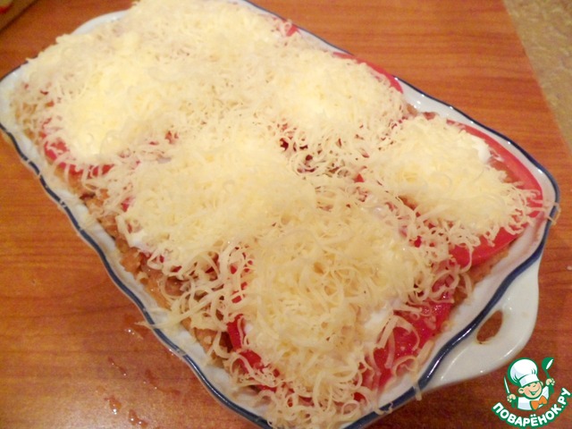 Buckwheat casserole with sausage links topped with tomato crust