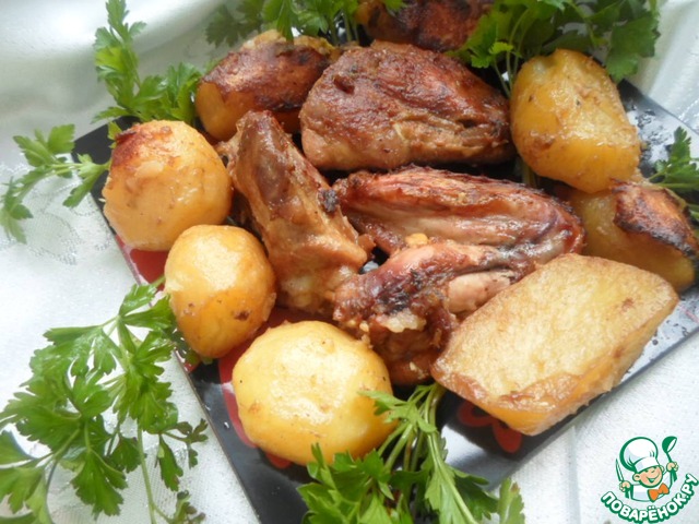 Chicken with potatoes baked in sauce