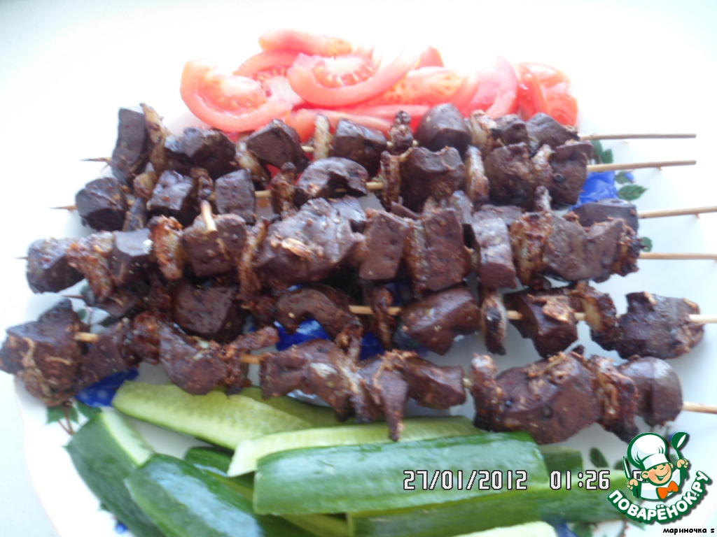 Skewers of liver with fat tail 