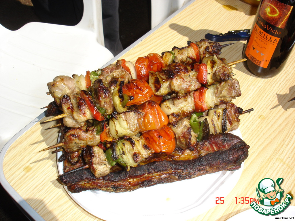 Pork and vegetables grilled over charcoal