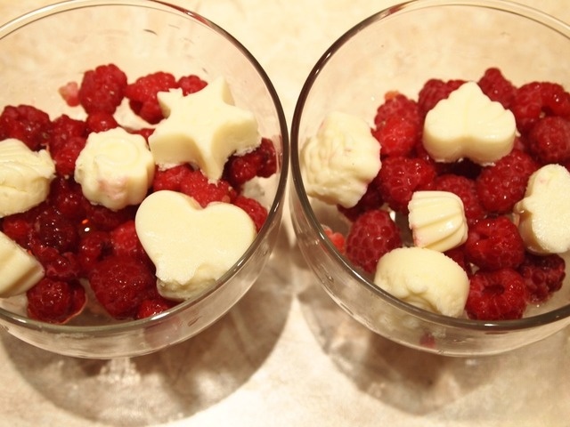 Orange dessert with ice cream and raspberries