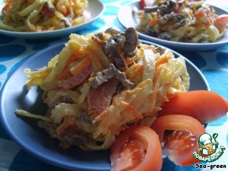 Salad with chicken hearts and pancakes