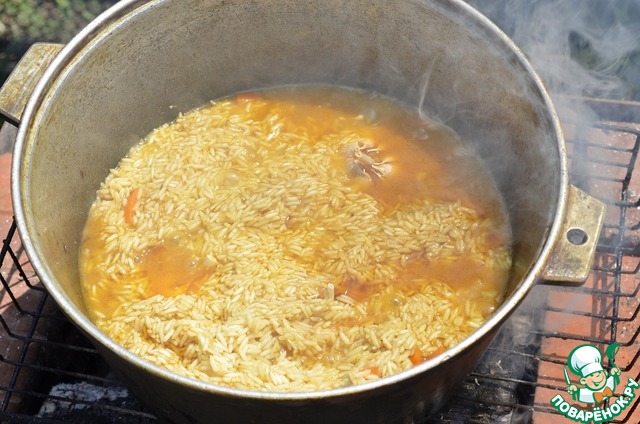 Pilau on the fire with the veal with prunes and dried apricots