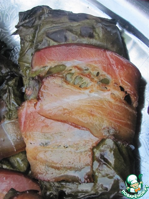 Fish in grape leaves grilled