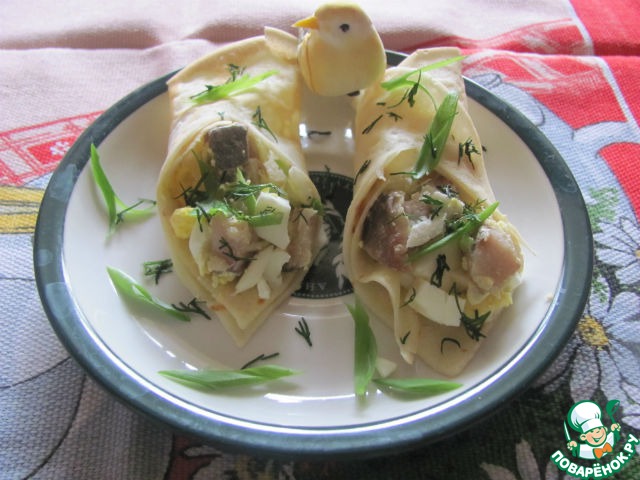 Thin pancakes with herring