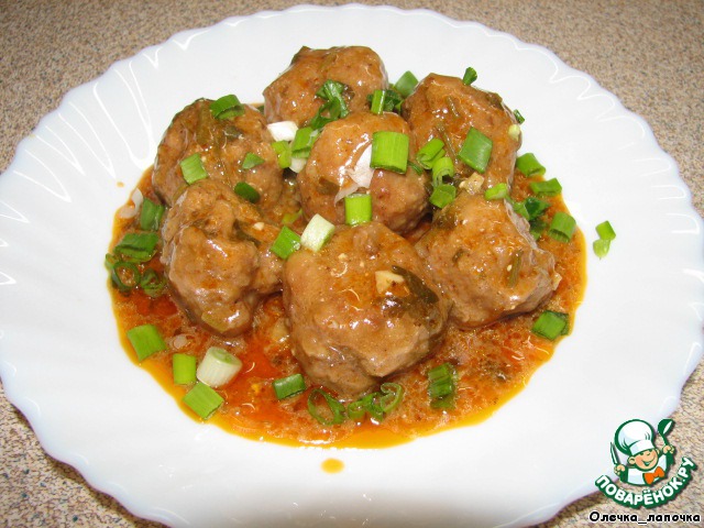 Meatballs in sauce with cilantro