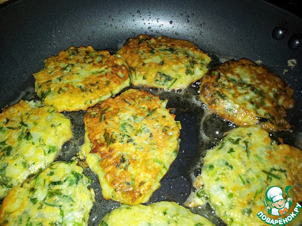 Green pancakes-patties of fresh cilantro