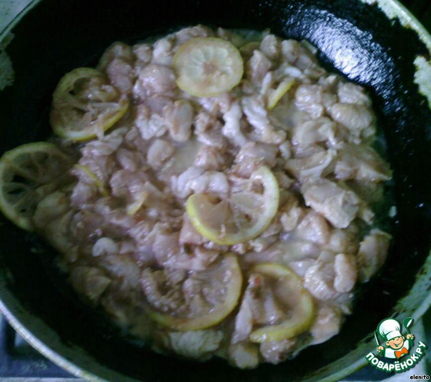 The chicken in the marinade from adzhika and lemon