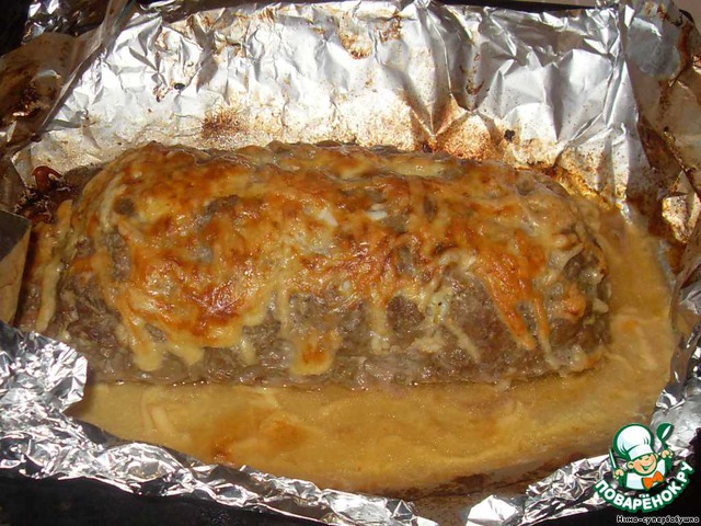 Meatloaf with eggs under cheese crust