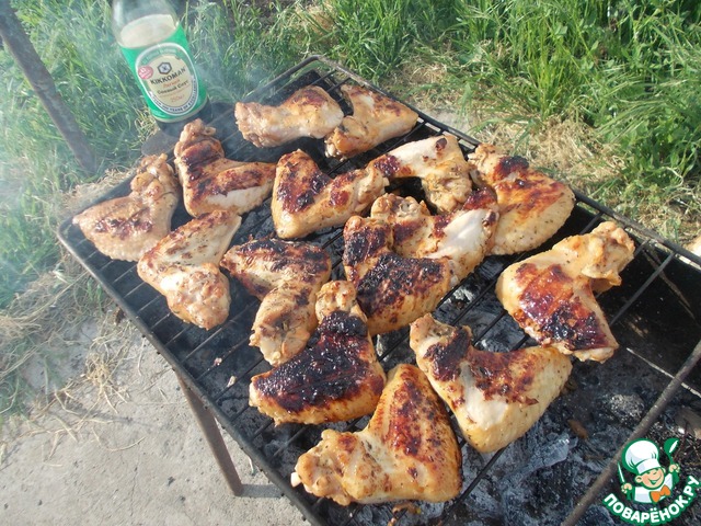 Wings of chicken in tkemali sauce with tarragon