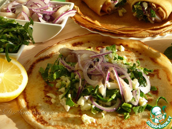 Pancakes with herring and onion