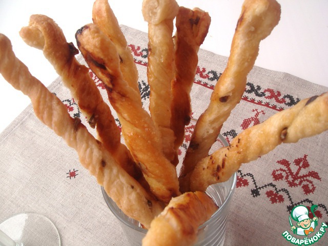 Puff pastry grissini with anchovy and brown sugar