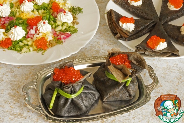 Vegetable topping of caviar to the black pancakes