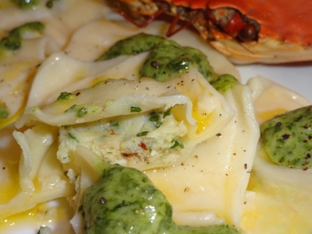 Ravioli with crab meat and mozzarella with spinach sauce