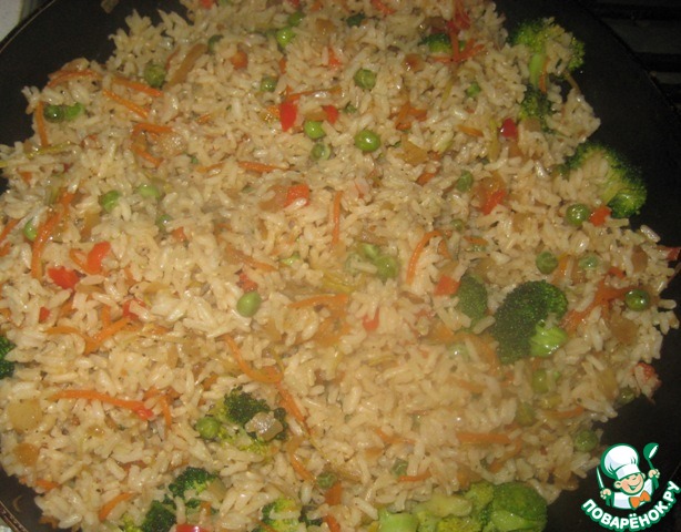 A side dish of rice and vegetables