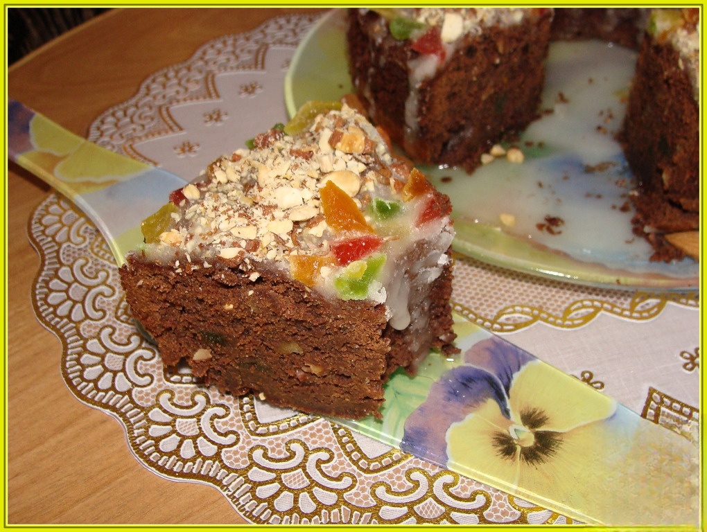 Chocolate cake with candied fruit and almonds