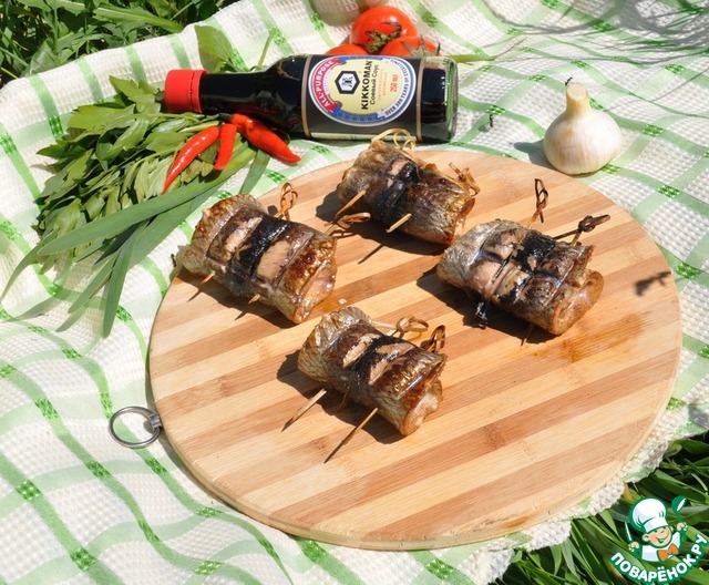 Rolls of herring on the grill 