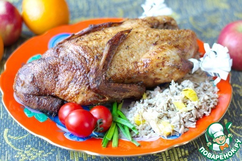 Duck with wild rice, apples and orange