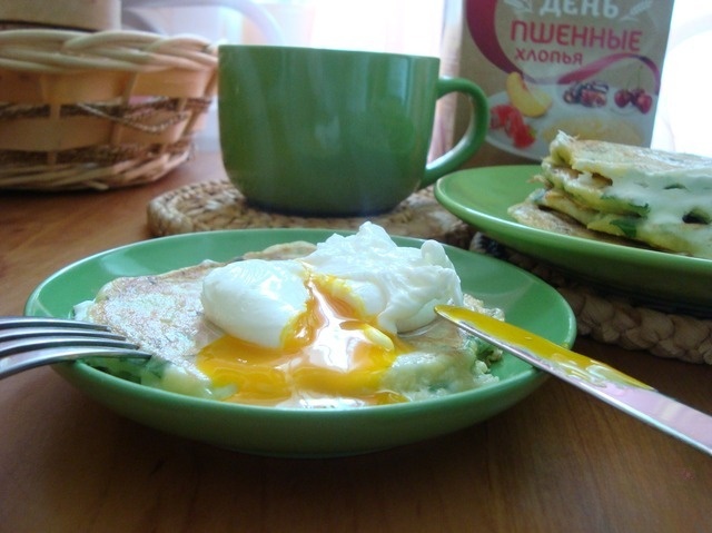 Millet pancakes with full sun and a poached egg