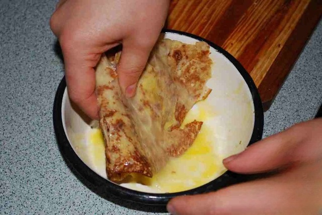 Pancakes stuffed with stringy cheese, fried in egg