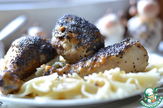 Chicken drumsticks in a mustard sauce with poppy seeds