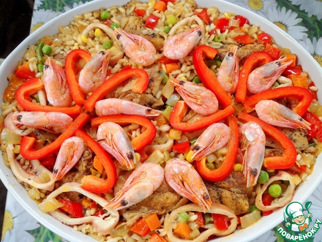 Paella with chicken and seafood