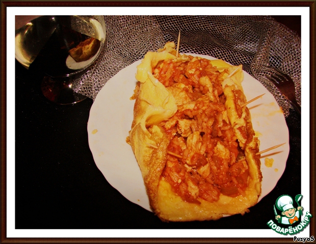 Rice with chicken in an egg wrapper