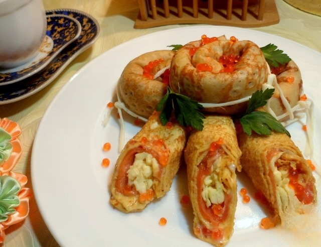 Pancakes with salmon and scrambled eggs