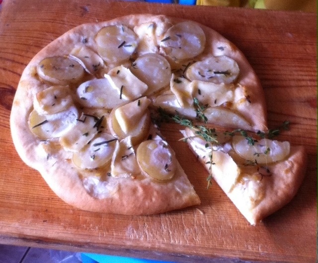 Pizza with potatoes and soft cheese
