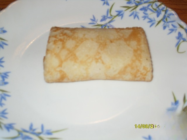 Pancakes stuffed with cottage cheese mass 