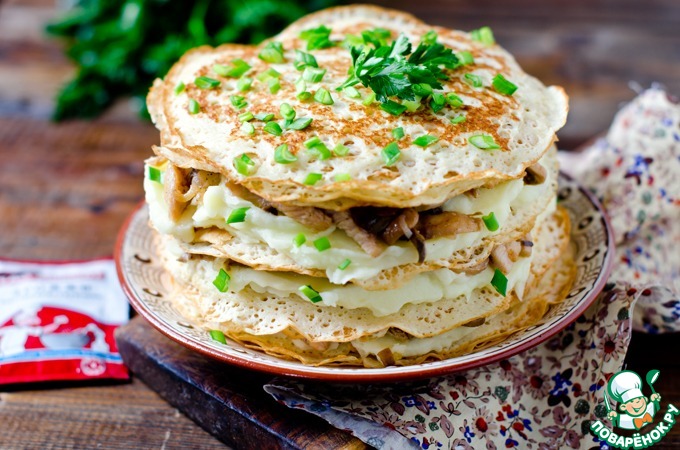 Pancake pie with chicken and mushrooms