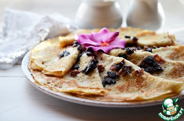 Yeast pancakes with prunes and nuts