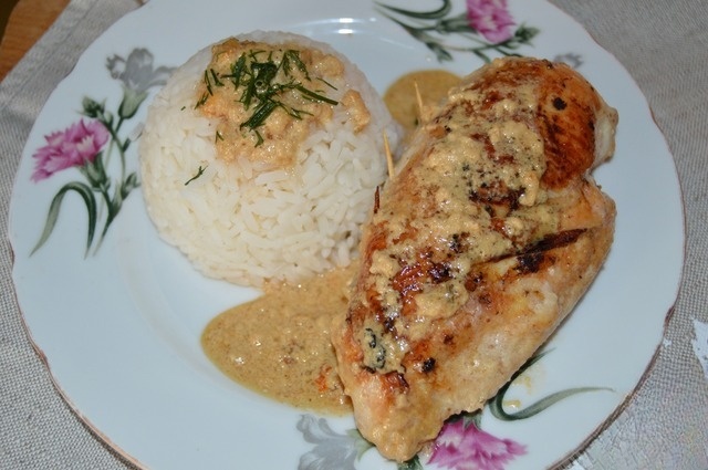 Chicken fillet stuffed with mushrooms in sauce