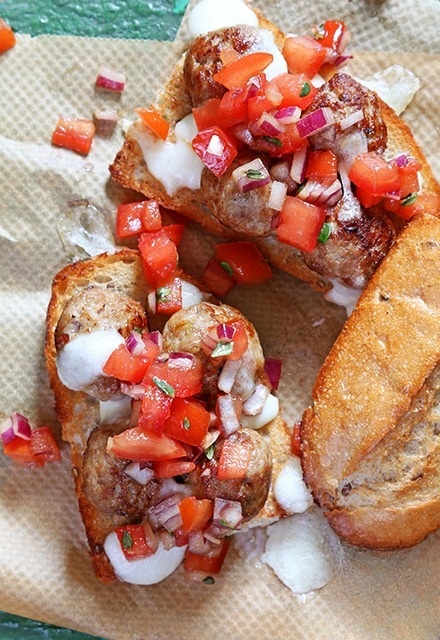 Sandwiches with meatballs, mozzarella and tomato salsa