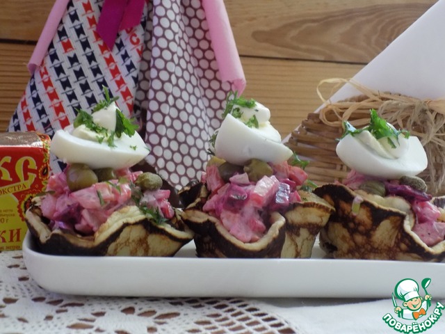 Pancake tartlets with herring under a fur coat
