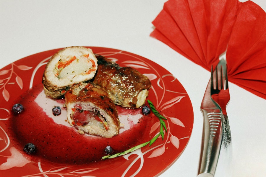 Roulade of pork with pomelo and blueberry sauce
