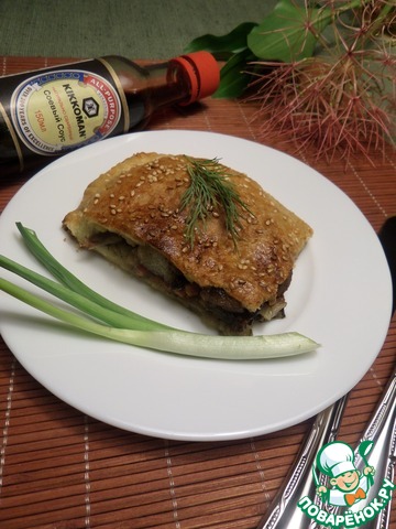 Pie with cabbage, pork and prunes