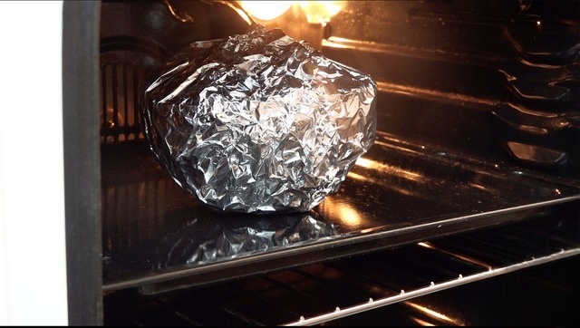 Baked stuffed pumpkin with pork and potatoes