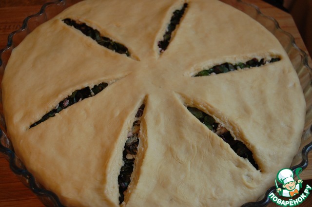 Autumn pie with cheese and beet leaves