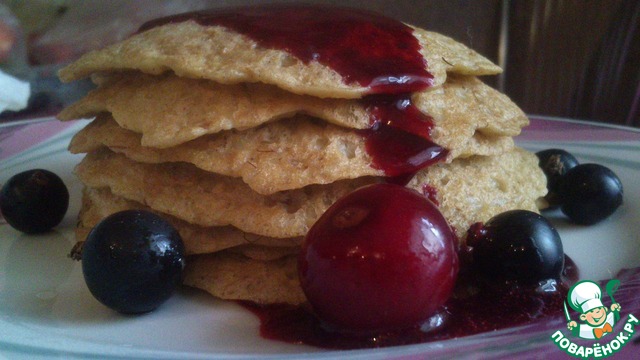 Pancakes, oatmeal with berry watering