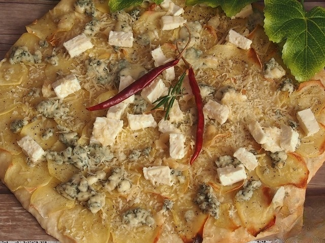 Pizza with potatoes and cheese